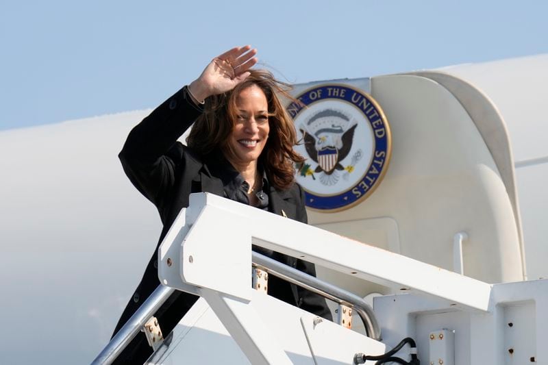 Democratic presidential nominee Vice President Kamala Harris waves to the media as she boards Air Force Two at John Murtha Johnstown-Cambria Airport, in Johnstown, Pa. Friday, Sept. 13, 2024. (AP Photo/Jacquelyn Martin)