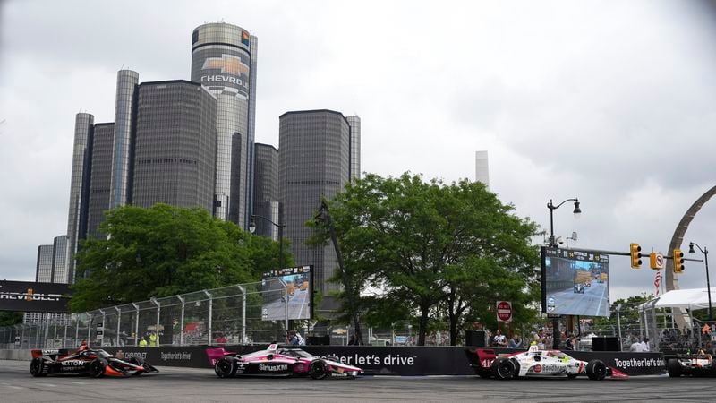 Drivers make a turn during the IndyCar Detroit Grand Prix auto race in Detroit, Sunday, June 2, 2024. (AP Photo/Paul Sancya)