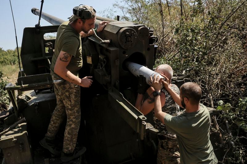 In this photo provided by Ukraine's 24th Mechanised Brigade press service, servicemen of the 24th Mechanised Brigade fire a" Giatsint-S" 152mm self-propelled howitzer towards Russian positions near Chasiv Yar town, in Donetsk region, Ukraine, Tuesday, Aug. 20, 2024. (Oleg Petrasiuk/Ukrainian 24th Mechanised Brigade via AP)