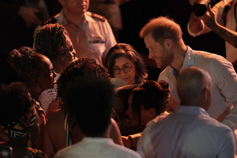 Prince Harry greets people during a forum on Afro women and power in Cali, Colombia, Sunday, Aug. 18, 2024. (AP Photo/Ivan Valencia)