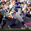 New York Mets' Francisco Lindor hits a solo home run during the sixth inning of a baseball game against the Milwaukee Brewers, Sunday, Sept. 29, 2024, in Milwaukee. (AP Photo/Aaron Gash)