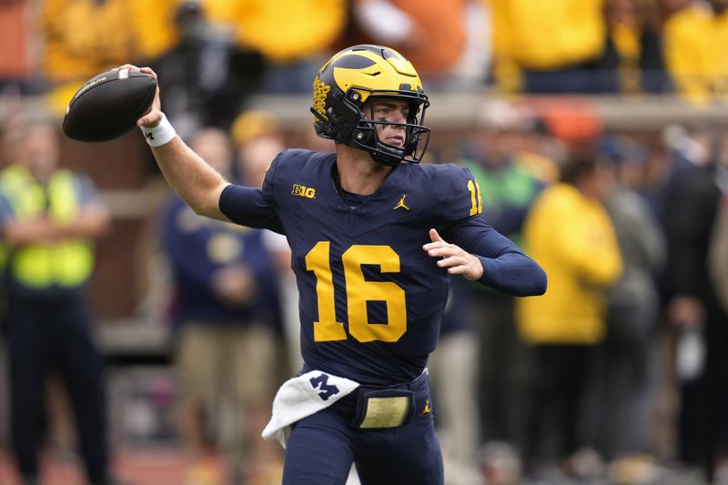 Michigan quarterback Davis Warren throws against the Texas in the first half of an NCAA college football game in Ann Arbor, Mich., Saturday, Sept. 7, 2024. (AP Photo/Paul Sancya)