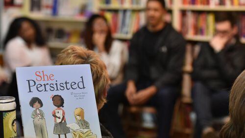 Participants talk during a monthly Race-Conscious Parenting Collective meeting at Charis Books and More. This group is designed to support the ongoing development of white parents of white and multiracial children who are seeking to unlearn and dismantle white privilege within their families, schools, neighborhoods and faith communities. HYOSUB SHIN / HSHIN@AJC.COM