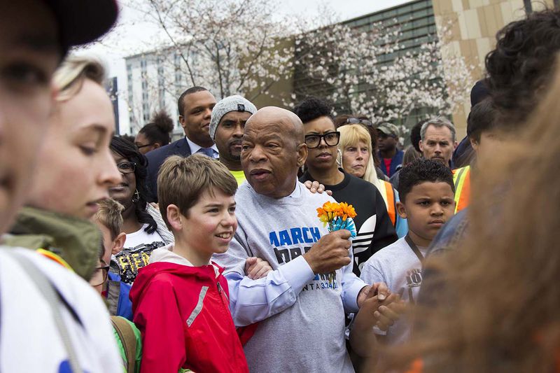 Congressman John Lewis marches with students during the March for our Lives event in Atlanta, Georgia, on Saturday, March 24, 2018. (REANN HUBER/REANN.HUBER@AJC.COM)