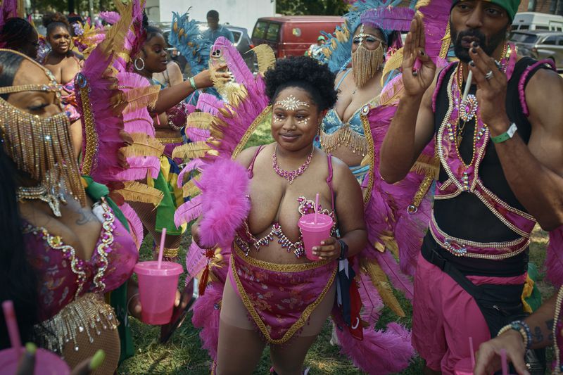 People march in the West Indian Day Parade on Monday, Sept. 2, 2024, in the Brooklyn borough of New York. (AP Photo/Andres Kudacki)