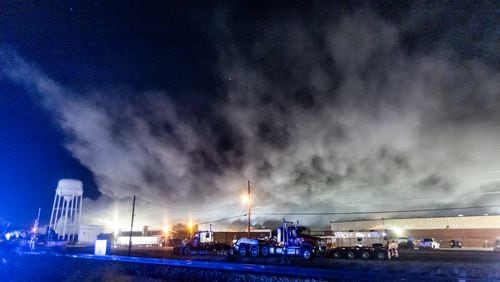 The plume of smoke rising from BioLab as seen from Old Covington Hwy continued on Thursday, Oct. 3, 2024 in Conyers. A Sunday fire at the chemical plant in Conyers has had agencies monitoring the air quality since then as crews try to neutralize the site. Rockdale County officials said that the plume is changing colors as workers remove debris. GEMA has advised anyone who notices a chlorine odor in the air to limit their time outdoors. (John Spink/AJC)