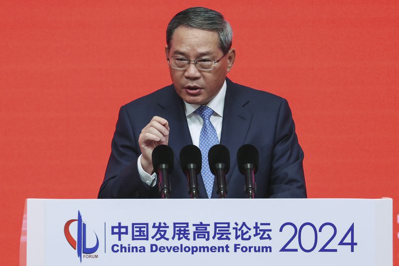 FILE - Chinese Premier Li Qiang delivers a keynote speech during the annual meeting of the China Development Forum at the Diaoyutai Guesthouse in Beijing, China on March 24, 2024. Li arrived in New Zealand on Thursday, June 13, 2024, beginning a rare visit to its closest partner among Western democracies, where a celebration of trade links is expected to vie with concerns about South Pacific security on Wellington's agenda. (Wu Hao/Pool Photo via AP, File)