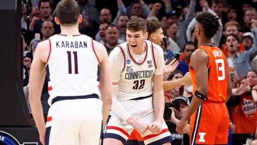 Connecticut Huskies center Donovan Clingan (32) celebrates his bucket as UConn takes on Illinois in the NCAA Men’s East Regional basketball playoffs at TD Garden on Saturday, March 30, 2024, in Boston. (Stuart Cahill/Boston Herald/TNS)