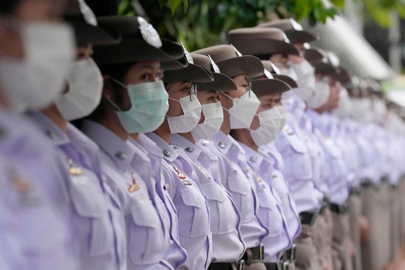 Nurse students pay respect to one of the victims of a school bus fire, at Police hospital in Bangkok, Thailand, Wednesday, Oct. 2, 2024. (AP Photo/Sakchai Lalit)