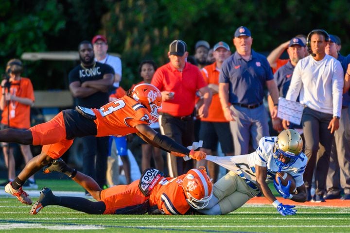 McEachern’s Maurice Crockett is tackled during the football game at North Cobb in Kennesaw, GA on August 23, 2024 (Jamie Spaar for the Atlanta Journal Constitution)