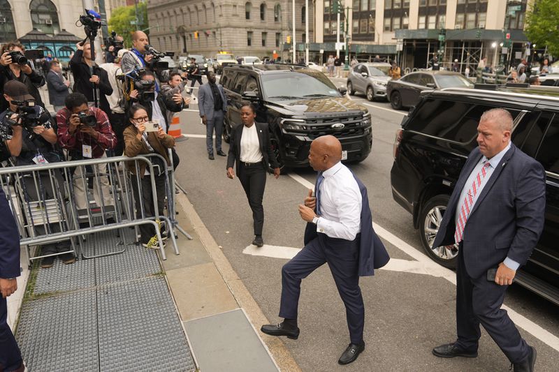 New York City Mayor Eric Adams, second from right, arrives to court in New York, Wednesday, Oct. 2, 2024. (AP Photo/Seth Wenig)