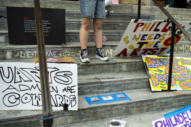Signs and writing denouncing the closure of the University of the Arts are pictured at Dorrance Hamilton Hall, Friday, June 14, 2024, in Philadelphia. (AP Photo/Joe Lamberti)
