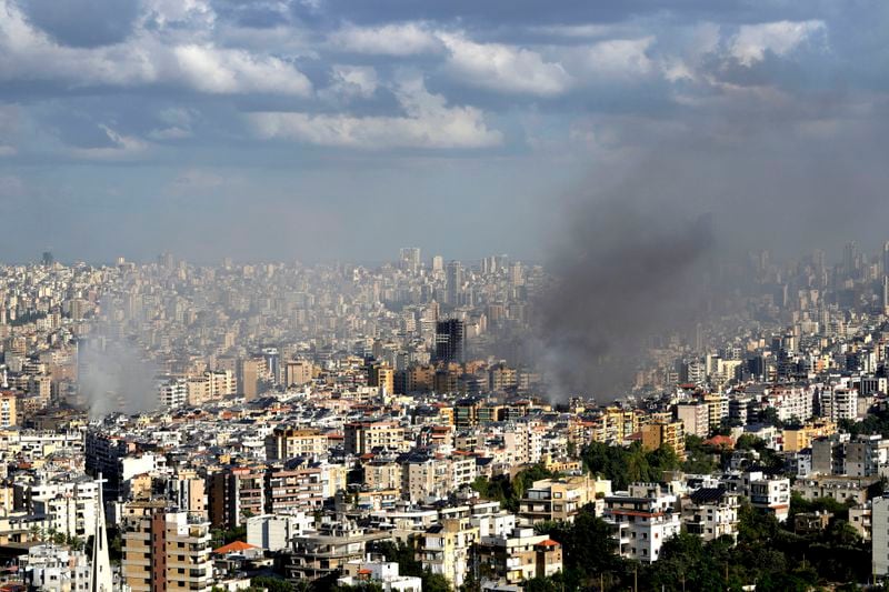 Smoke rises from neighbourhoods hit by Israeli airstrikes in Dahieh, Beirut, Lebanon, Wednesday, Oct. 2, 2024. (AP Photo/Hussein Malla)