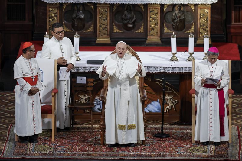 Pope Francis, center, speaks to members of the Catholic community at the Jakarta Cathedral in Jakarta, Indonesia, Wednesday, Sept. 4, 2024. (Yasuyoshi Chiba /Pool Photo via AP)