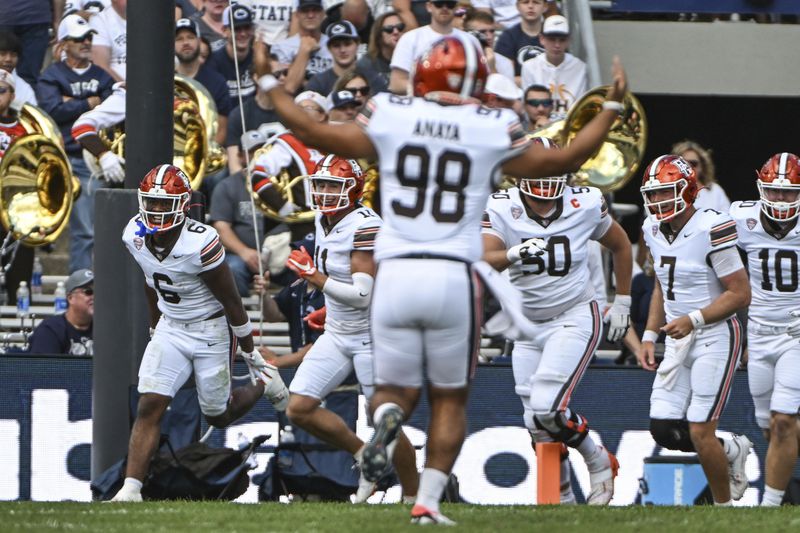 Bowling Green running back Jamal Johnson (6) celebrates a touchdown during the second quarter of an NCAA college football game against Penn State, Saturday, Sept. 7, 2024, in State College, Pa. (AP Photo/Barry Reeger)