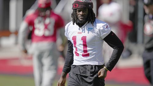 FILE - San Francisco 49ers wide receiver Brandon Aiyuk (11) warms up during a practice ahead of the Super Bowl 58 NFL football game Saturday, Feb. 10, 2024, in Las Vegas. (AP Photo/John Locher, File)