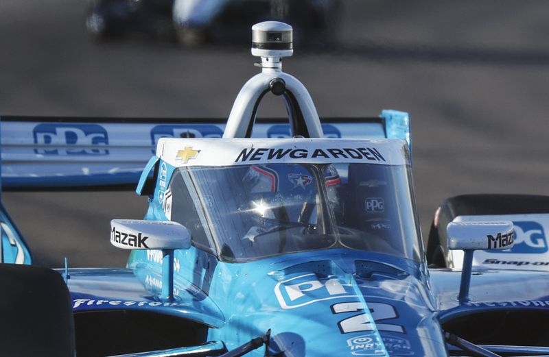 Josef Newgarden steers his car during an IndyCar auto race on Saturday, Aug. 17, 2024, at World Wide Technology Raceway in Madison, Ill. (Zachary Linhares/St. Louis Post-Dispatch via AP)