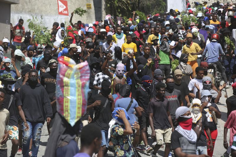 People protest for the police and Prime Minister to take immediate action against gangs in Port-au-Prince, Haiti, Monday, Aug. 19, 2024. (AP Photo/Odelyn Joseph)