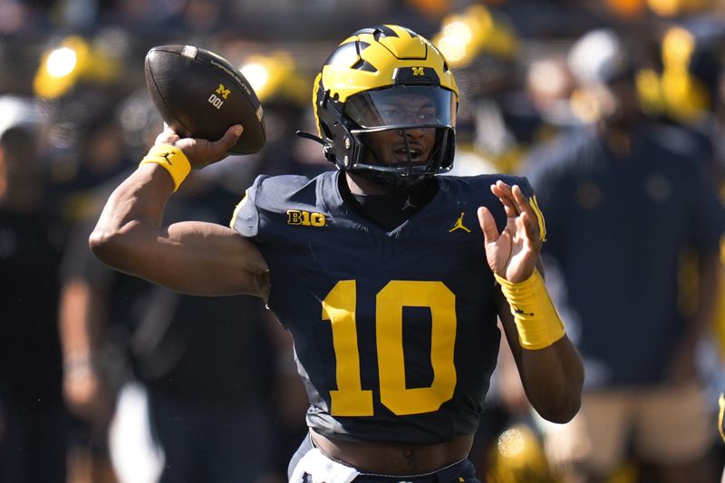 Michigan quarterback Alex Orji throws against Southern California in the first half of an NCAA college football game in Ann Arbor, Mich., Saturday, Sept. 21, 2024. (AP Photo/Paul Sancya)