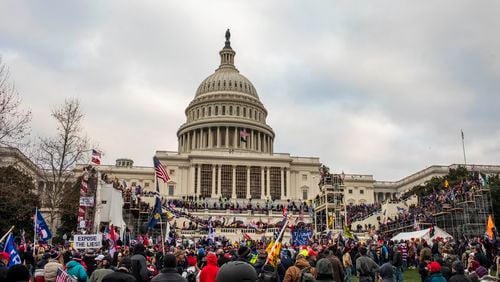 Members of a pro-Trump mob storm the Capitol in Washington, Jan. 6, 2021. What appeared to be racial progress in rural Virginia turned into bitter conflict over a Confederate statue, the election and the Capitol riot. Now, people there foresee “a very dangerous time.” (Jason Andrew/The New York Times)