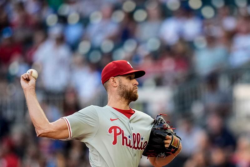 Philadelphia Phillies pitcher Zack Wheeler (45) delivers in the first inning of a baseball game against the Atlanta Braves, Tuesday, Aug. 20, 2024, in Atlanta. (AP Photo/Mike Stewart)