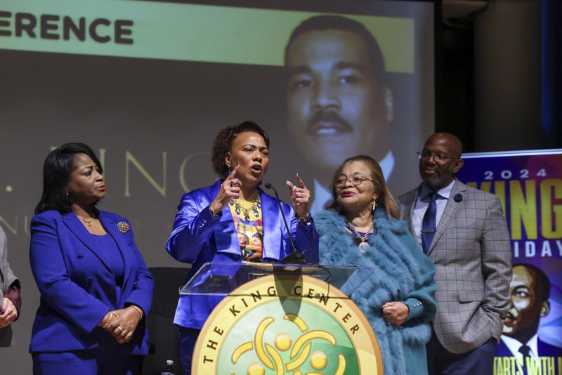 Bernice King, center, speaks during a press conference on the passing of her brother, Dexter Scott King. She is flanked by her cousins, Angela Farris Watkins and Alveda King. 
They are each the granddaughters of Alberta and Martin Luther "Daddy" King and represent a third generation of King family members. (Jason Getz/jason.getz@ajc.com)