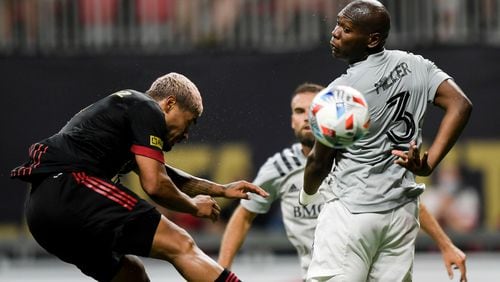 Atlanta United forward Josef Martinez (7) and Montreal's Kamal Miller (3) fight for possession of the ball in the second half Saturday, May 15, 2021 at Mercedes-Benz Stadium in Atlanta. (Daniel Varnado/For the AJC)