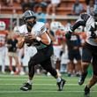 North Atlanta quarterback Ian Reynolds (15) rolls out of the pocket as he looks to pass against Kell during the first half of the Corky Kell Dave Hunter Classic at Kell High School, Wednesday, August 14, 2024, in Marietta, Ga. (Jason Getz / AJC)
