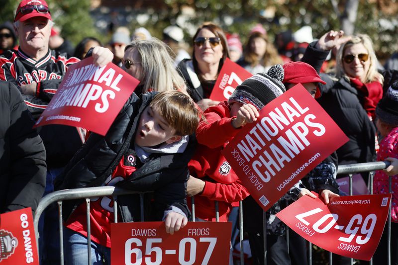 Fans celebrate Georgia’s College Football Playoff national championship during the victory parade in Athens on Saturday, Jan. 14, 2023. The Bulldogs reportedly have yet to receive an invitation to visit the White House in Washington, D.C. (Miguel Martinez/The Atlanta Journal Constitution)