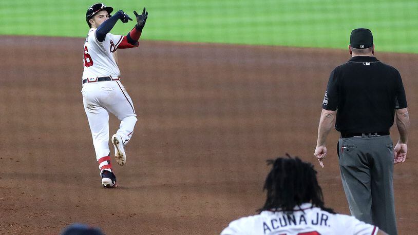 Travis d'Arnaud of the Atlanta Braves celebrates his three run