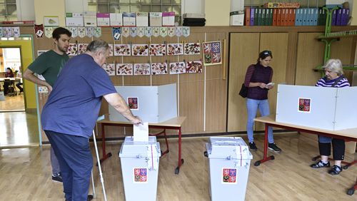 A man votes in the second round of voting for a third of the seats in Parliament’s upper house. at a polling station in Prague, Czech Republic, Friday Sept. 27, 2024. (Roman Vondrous/CTK via AP)