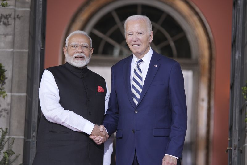 President Joe Biden greets India's Prime Minister Narendra Modi at the Quad leaders summit at Archmere Academy in Claymont, Del., Saturday, Sept. 21, 2024. (AP Photo/Mark Schiefelbein)