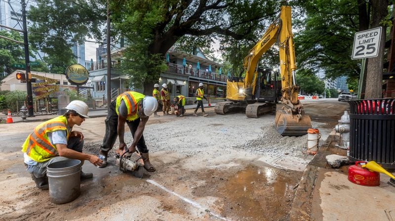 Crews continue to work where a water main burst near West Peachtree and 11th Street in Midtown.