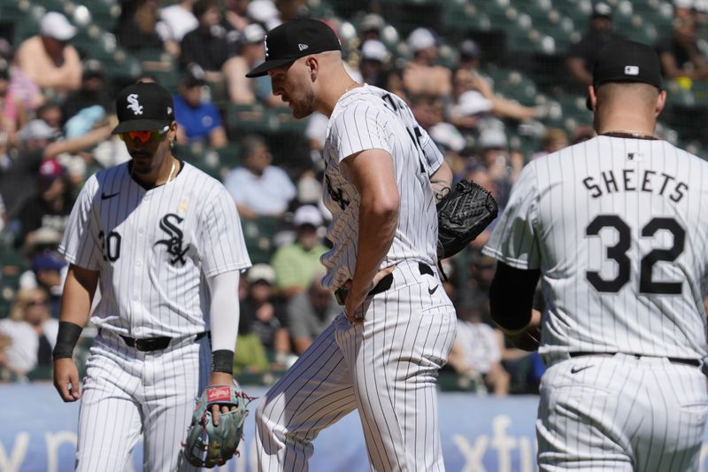 Chicago White Sox starting pitcher Garrett Crochet, center, reacts during the fourth inning of a baseball game against the New York Mets in Chicago, Sunday, Sept. 1, 2024. (AP Photo/Nam Y. Huh)