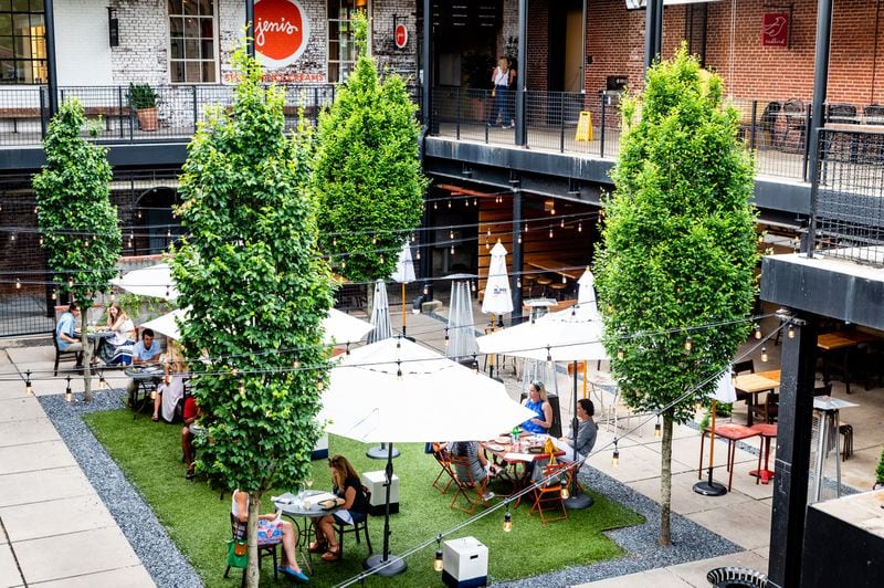 The courtyard at Westside Provisions District, where JCT Kitchen and Forza Storico both seat customers, has been arranged with socially distanced tables. CONTRIBUTED BY HENRI HOLLIS