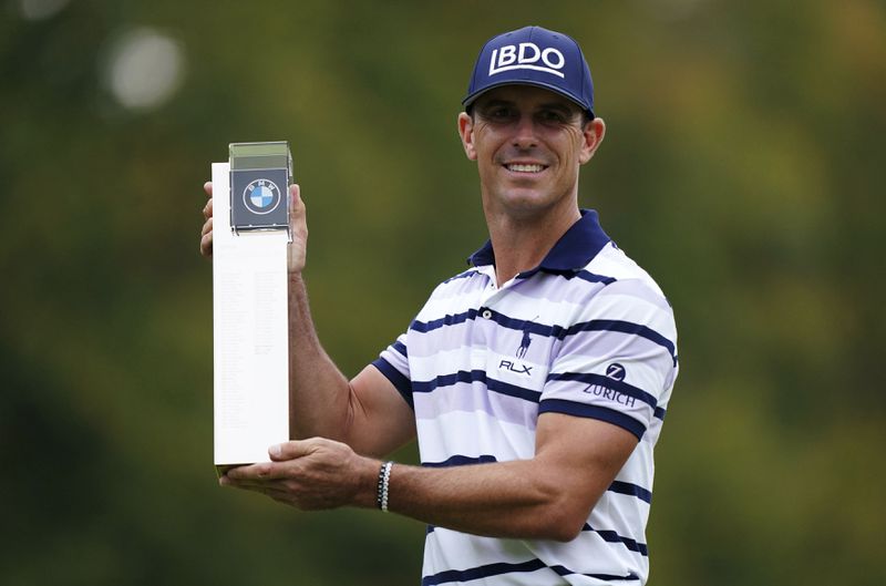 Billy Horschel of the U.S. displays the trophy following day four of the PGA Championship at Wentworth Golf Club in Virginia Water, England, Sunday Sept. 22, 2024. (Zac Goodwin/PA via AP)