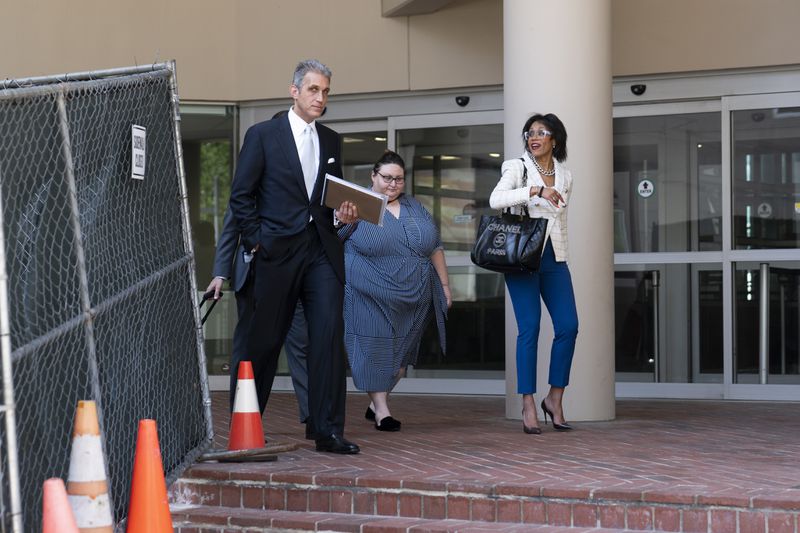 Baltimore City attorneys Adam Levitt, left, and Diandra Debrasse, right, leave the Edward A. Garmatz United States District Courthouse in Baltimore, Thursday, June 20, 2024. (AP Photo/Stephanie Scarbrough)