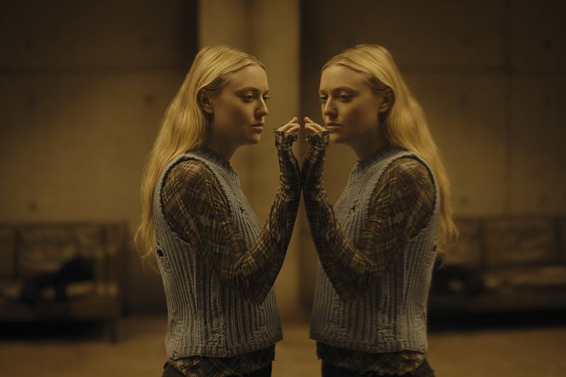 This image released by Warner Bros. Pictures shows Dakota Fanning in a scene from "The Watchers." (Warner Bros. Pictures via AP)