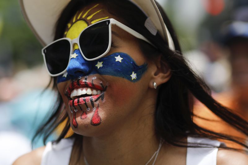 Opposition supporters protest the reelection of President Nicolás Maduro one month after the disputed vote, which opposition leaders claim they won by a landslide, in Caracas, Venezuela, Wednesday, Aug. 28, 2024. (AP Photo/Cristian Hernandez)