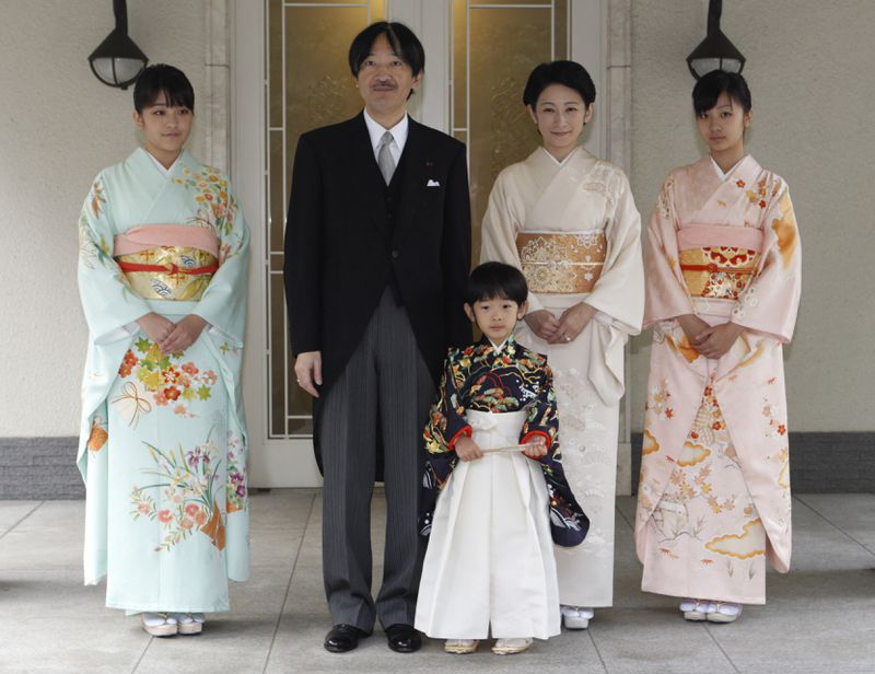 FILE - Japan's Prince Hisahito, wearing a traditional ceremonial attire, is accompanied by his parents, Prince Akishino, Princess Kiko, his sisters Princess Mako, left, and Princess Kako, right, after attending "Chakko-no-gi" ceremony to celebrate his growth and the passage from infancy to childhood, at the Akasaka imperial estate in Tokyo, Nov. 3, 2011. (AP Photo/Issei Kato, Pool, File)