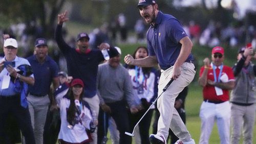 United States team member Patrick Cantlay reacts after making the winning putt on the 18th hole during their fourth round foursomes match at the Presidents Cup golf tournament at Royal Montreal Golf Club Saturday, Sept. 28, 2024 in Montreal. (Nathan Denette/The Canadian Press via AP)