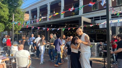 Attendees at the 2023 Rum-Ba Festival hosted by Fogón and Lions dance together.