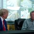 Republican presidential nominee former President Donald Trump talks with Georgia Gov. Brian Kemp during a briefing at the Columbia County Emergency Management Agency as he visits areas impacted by Hurricane Helene, Friday, Oct. 4, 2024, in Evans, Ga. (AP Photo/Evan Vucci)