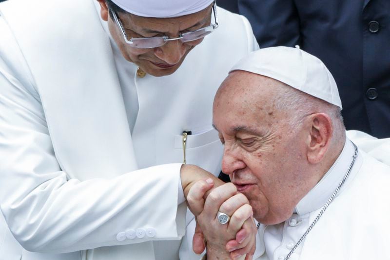 Pope Francis, right, kisses the right hand of the Grand Imam of Istiqlal Mosque Nasaruddin Umar after an interreligious meeting with religious leaders at the Istiqlal Mosque in Jakarta, Thursday, Sept. 5, 2024. (Aditya Aji /Pool Photo via AP)