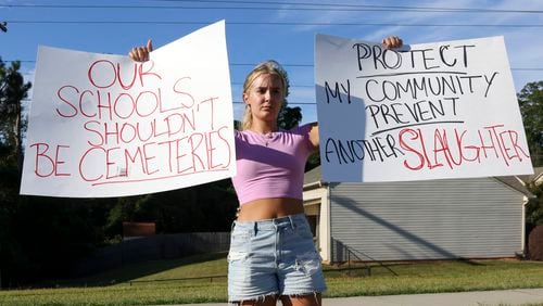 Gretchen Gierlach, 18, of Gwinnett County, shows her thoughts about the recent shooting at Apalachee High School, Wednesday, Sept. 4, 2024, in Winder, Ga. Gierlach is a recent high school graduate of Dacula high school and currently enrolled at Georgia Gwinnett College. One person is in custody after a shooting at Apalachee High School in Barrow County injured multiple people Wednesday morning. (Jason Getz / AJC)
