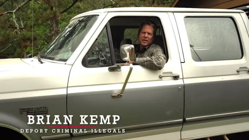A screenshot from Republican Brian Kemp's 2018 ad promising to "deport criminal illegals" in his pickup truck.