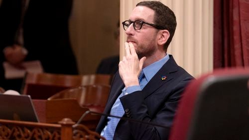 FILE - State Sen. Scott Wiener, D-San Francisco, watches as the Senate votes on a measure at the Capitol in Sacramento, Calif., Thursday, April 11, 2024. (AP Photo/Rich Pedroncelli,File)