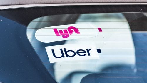 Uber Technologies Inc. has begun locking New York City drivers out of its app during periods of low demand in an attempt to fight a minimum wage rule, and Lyft Inc. is threatening to do the same.  (Dreamstime/TNS)
