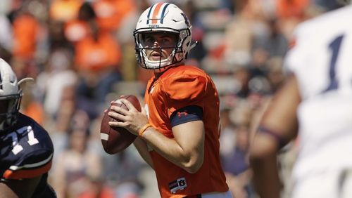 FILE - In this April 8, 2017, file photo, Auburn quarterback Jarrett Stidham looks for a receiver during Auburn's NCAA college football spring game in Auburn, Ala. Stidham, who began his college career at Baylor, went 16 of 20 for 267 yards in the spring game. (AP Photo/Todd J. Van Emst, File)