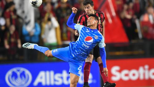 Roberto Aldana of the Motagua FC (front) and Fernando Meza battle for a header during the first half of soccer in the Scotiabank Concacaf Champions League, Tuesday, Feb. 25, 2020, in Kennesaw, Ga. (John Amis, Atlanta Journal Constitution)
